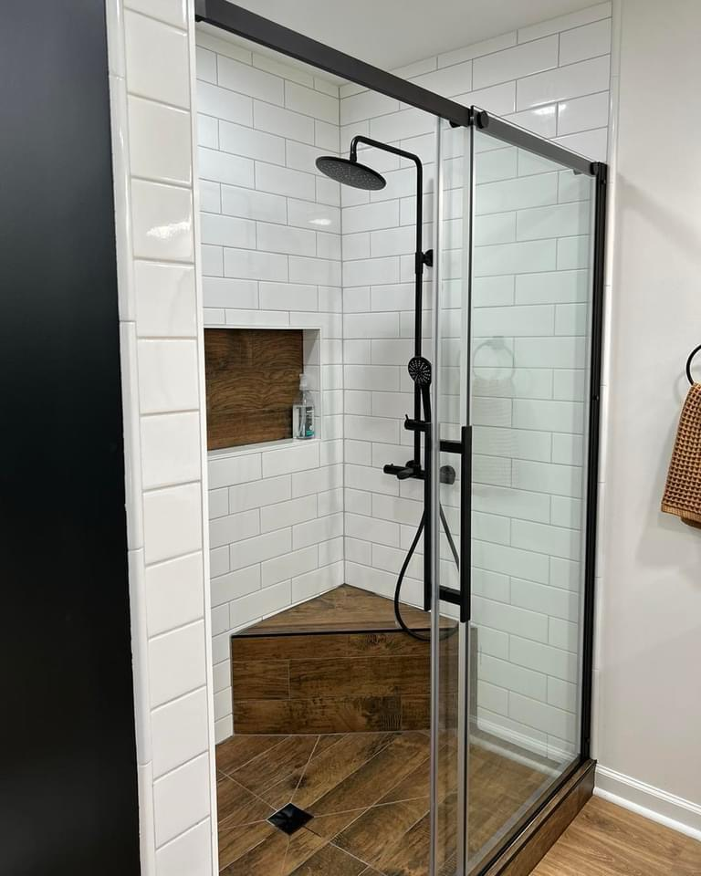 “Modern bathroom renovation in Halifax by 99 Contractors Ltd. featuring new tile, vanity, and shower installation.”